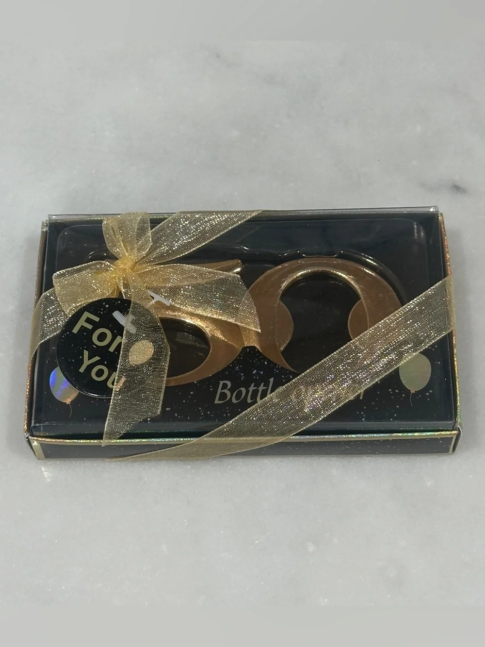 50th Celebration Gold Bottle Opener giveaway to guests